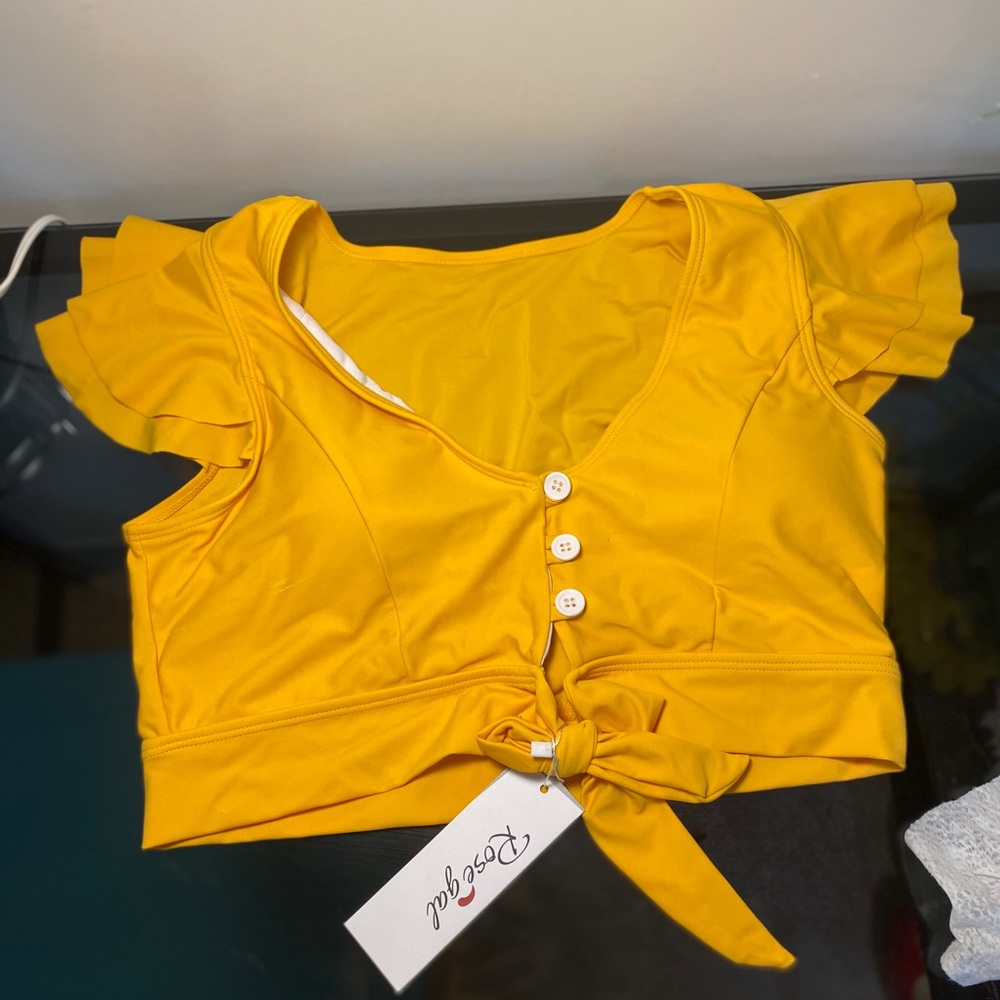 Yellow bathing suit top with ruffle sleeves